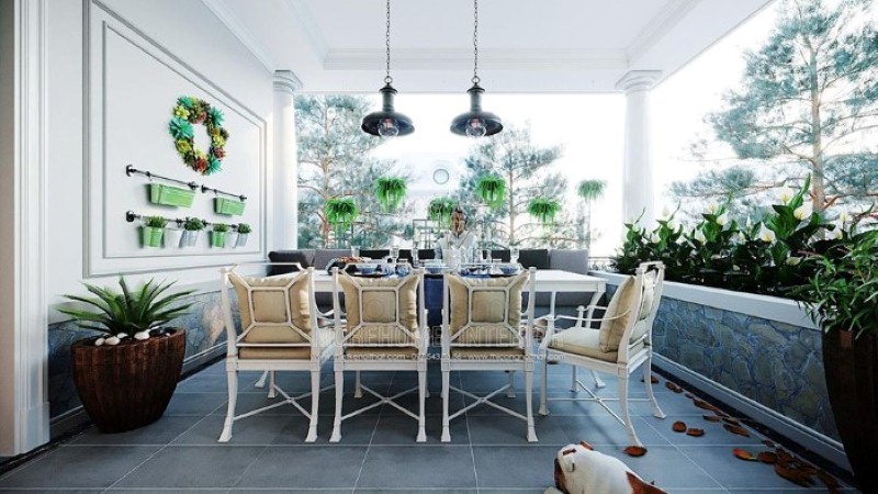 Sắp xếp không gian ăn uống ngoài trời đẹp mắt với hệ thống cây xanh tươi mát cùng bộ bàn ghế ăn êm ái. thiết kế thi công nội thất biệt thự cao cấp