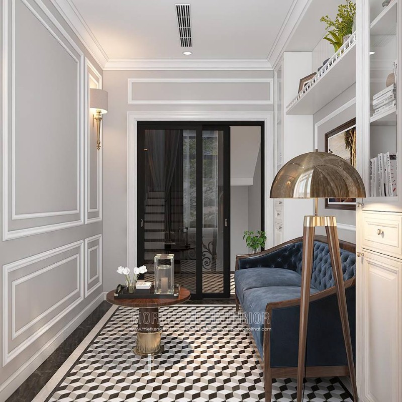 Gạch lát nền giả cổ, sofa băng gỗ óc chó tân cổ điển bọc nệm xanh cùng tường trắng đơn sắc đã tạo nên không gian đẹp sang trọng, đáp ứng tối đa công năng cho phòng đọc sách. thiết kế thi công nội thất biệt thự cao cấp