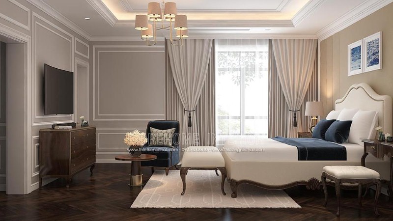 Giường bọc nệm trắng kết hợp sắc trầm từ ghế, đôn sofa, kệ tivi gỗ óc chó đã tạo nên bức tranh hài hòa, đẹp, sang trọng trong phòng ngủ master tân cổ điển. thiết kế thi công nội thất biệt thự cao cấp