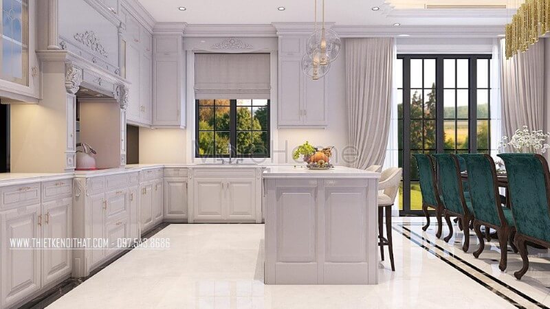 Không gian phòng bếp biệt thự được sử dụng khá nhiều các cột tròn với chi tiết chạm khắc nhẹ nhàng là một trong những đặc điểm điển hình của phong cách thiết kế nội thất tân cổ điển Thiết kế nội thất phòng bếp biệt thự tân cổ điển