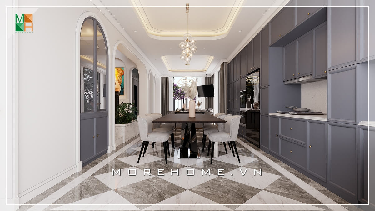 Nét tân cổ điển được thể hiện qua từng chi tiết, từ trần thạch cao giật cấp, từ những đường nét phào chỉ mềm mại trên cửa, từ đá lát sàn tông đen - trắng cổ điển, những đường bo cong trên bộ bàn ghế ăn đến bộ tủ bếp với những đường khắc đối xứng tinh tế Thi công nội thất biệt thự